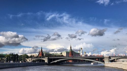 View of bridge over river against cloudy sky