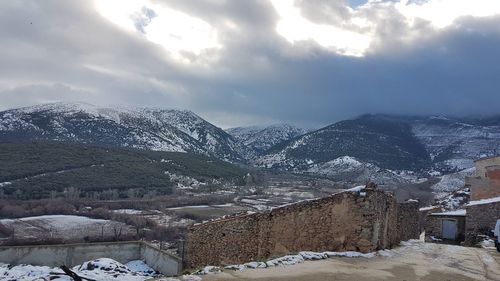 Scenic view of mountains against sky during winter