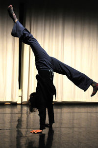 Full length of woman dancing on stage