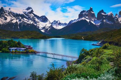 Scenic view of lake and mountains against sky