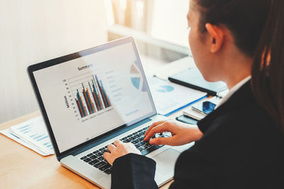 Low angle view of man using laptop