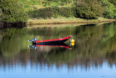 Red boat in lake