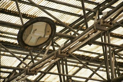 Low angle view of clock on ceiling