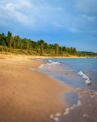 Surface level of beach against sky