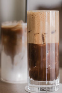 Close-up of coffee in glass on table