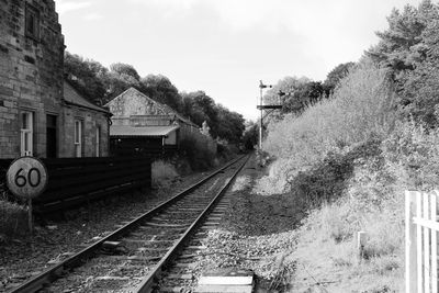 Train on railroad track against sky