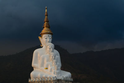 Statue of building against sky