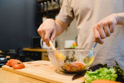 Midsection of man preparing food