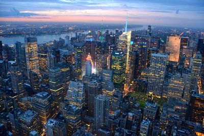 High angle view of illuminated cityscape at dusk