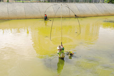 Man fishing in lake