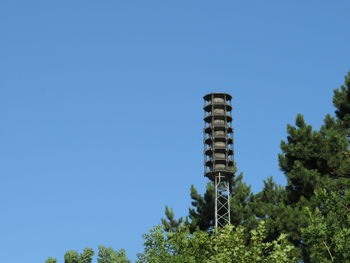 Low angle view of tower against clear blue sky