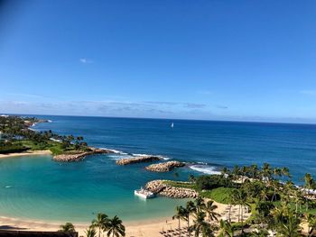 High angle view of sea against blue sky