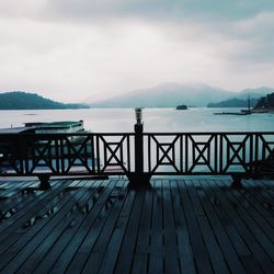 Scenic view of lake against cloudy sky