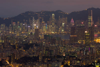 High angle view of illuminated buildings in city at night