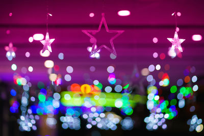 Close-up of illuminated christmas lights at night