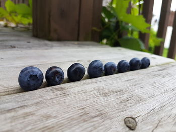 Close-up of fruits on wood