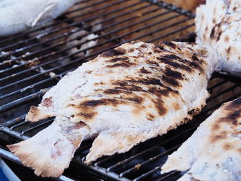 High angle view of meat on barbecue grill