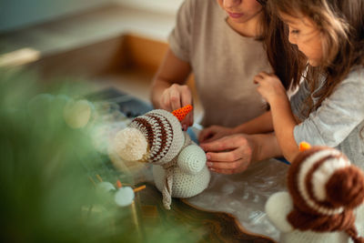 High angle view of woman with toys