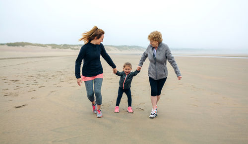 Family walking at beach