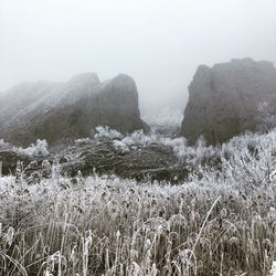 Scenic view of land against sky during winter