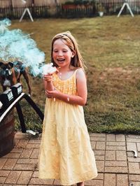 Portrait of smiling girl standing outdoors