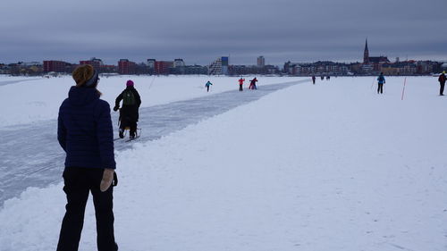 People on snow covered landscape