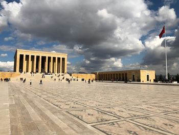 Built structure against cloudy sky in city