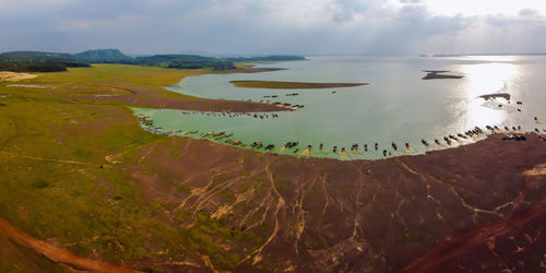 Scenic view of sea against cloudy sky