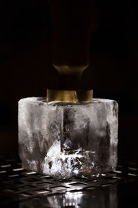 Close-up of ice cubes against black background