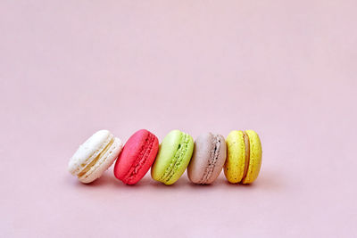 Close-up of multi colored candies against white background