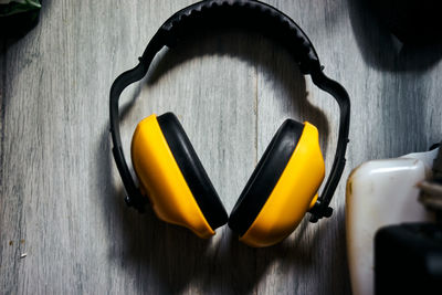 High angle view of yellow container on table