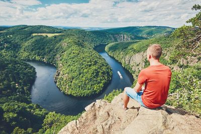 Man sitting on cliff