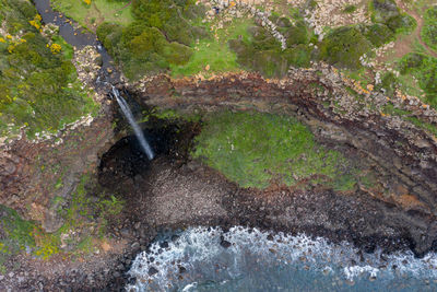 High angle view of cliff by sea