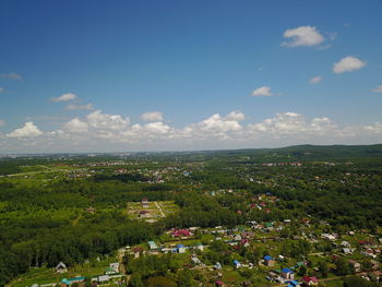 High angle view of trees and buildings against sky