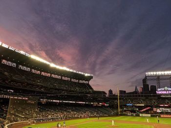 Group of people on soccer field at night