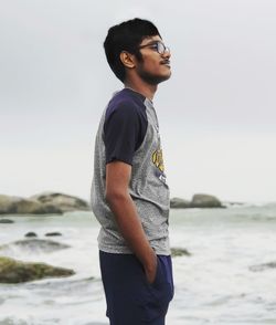 Side view of young man looking away