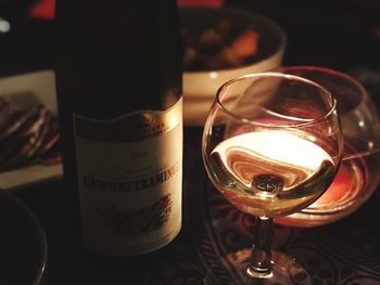 Close-up of wine glasses on table