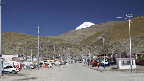 Panoramic view of ski lift against clear blue sky