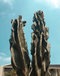 Low angle view of statue against sky