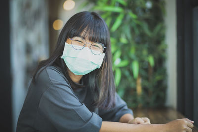 Portrait of smiling teenager girl wearing mask