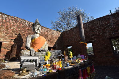 Low angle view of statue against sky