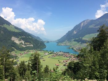 Scenic view of landscape and mountains against sky