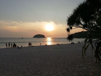 Scenic view of beach against sky during sunset