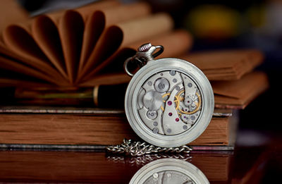 Close-up of clock on table