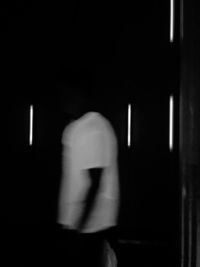 Blurred image of person walking at night