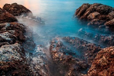 Scenic view of rock formation in sea