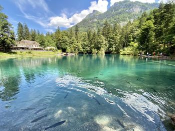 Scenic view of lake against cloudy sky