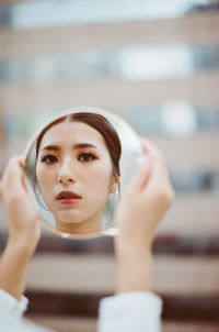 Portrait of young woman looking away