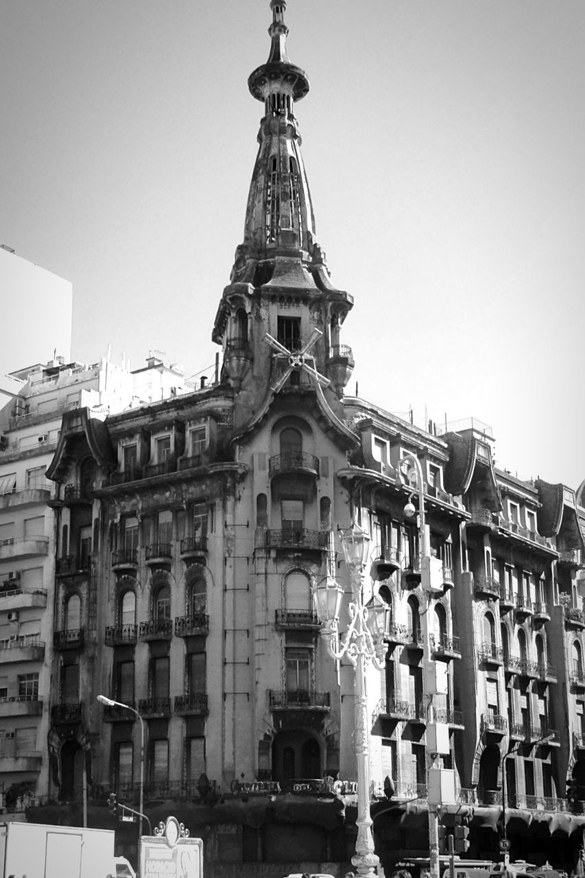 building exterior, architecture, built structure, low angle view, clear sky, religion, place of worship, church, spirituality, window, city, cathedral, facade, dome, history, day, outdoors, travel destinations