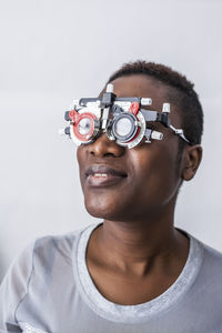 Black woman in optometry cabinet during study of the eyesight